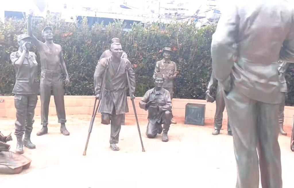 Visit the “Kissing Sailor” Statue